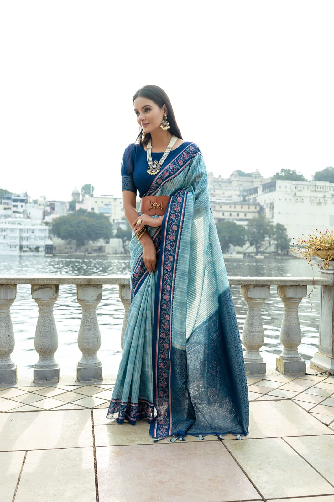 Sky blue color soft tussar silk saree with zari weaving work