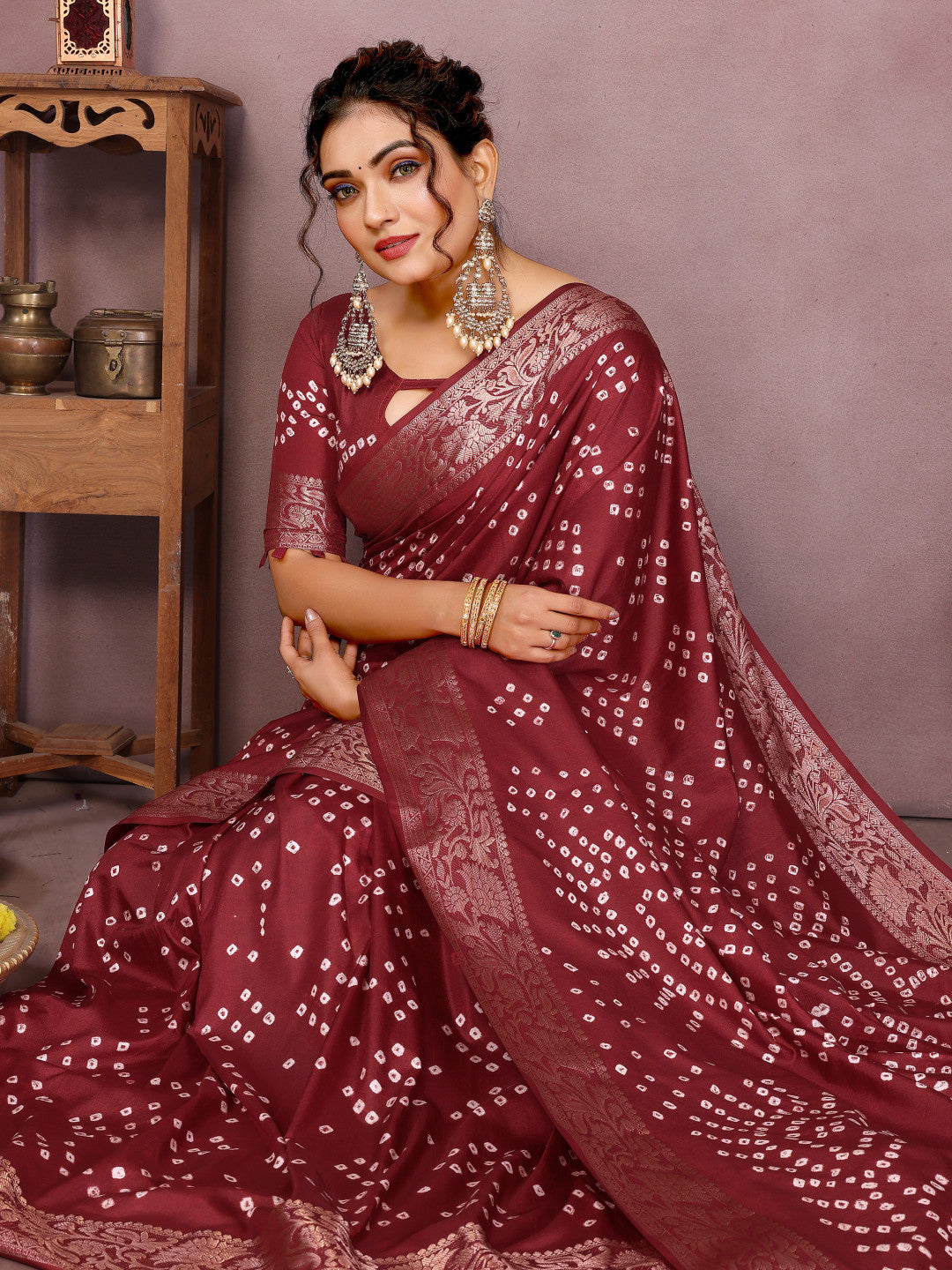 Maroon colour hand bandhej bandhani saree with zari weaving work