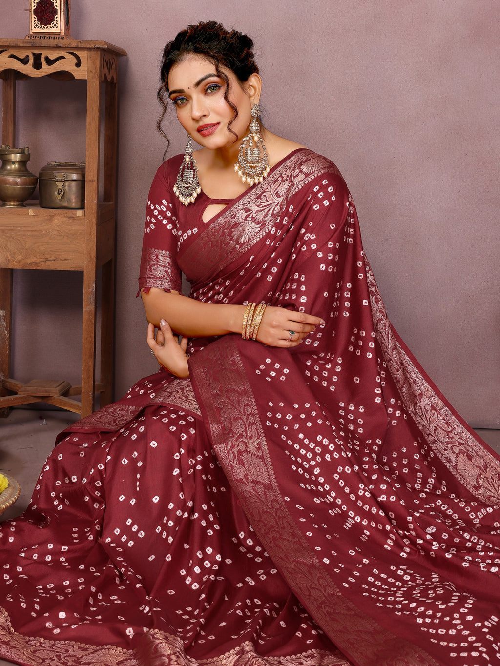 Maroon colour hand bandhej bandhani saree with zari weaving work