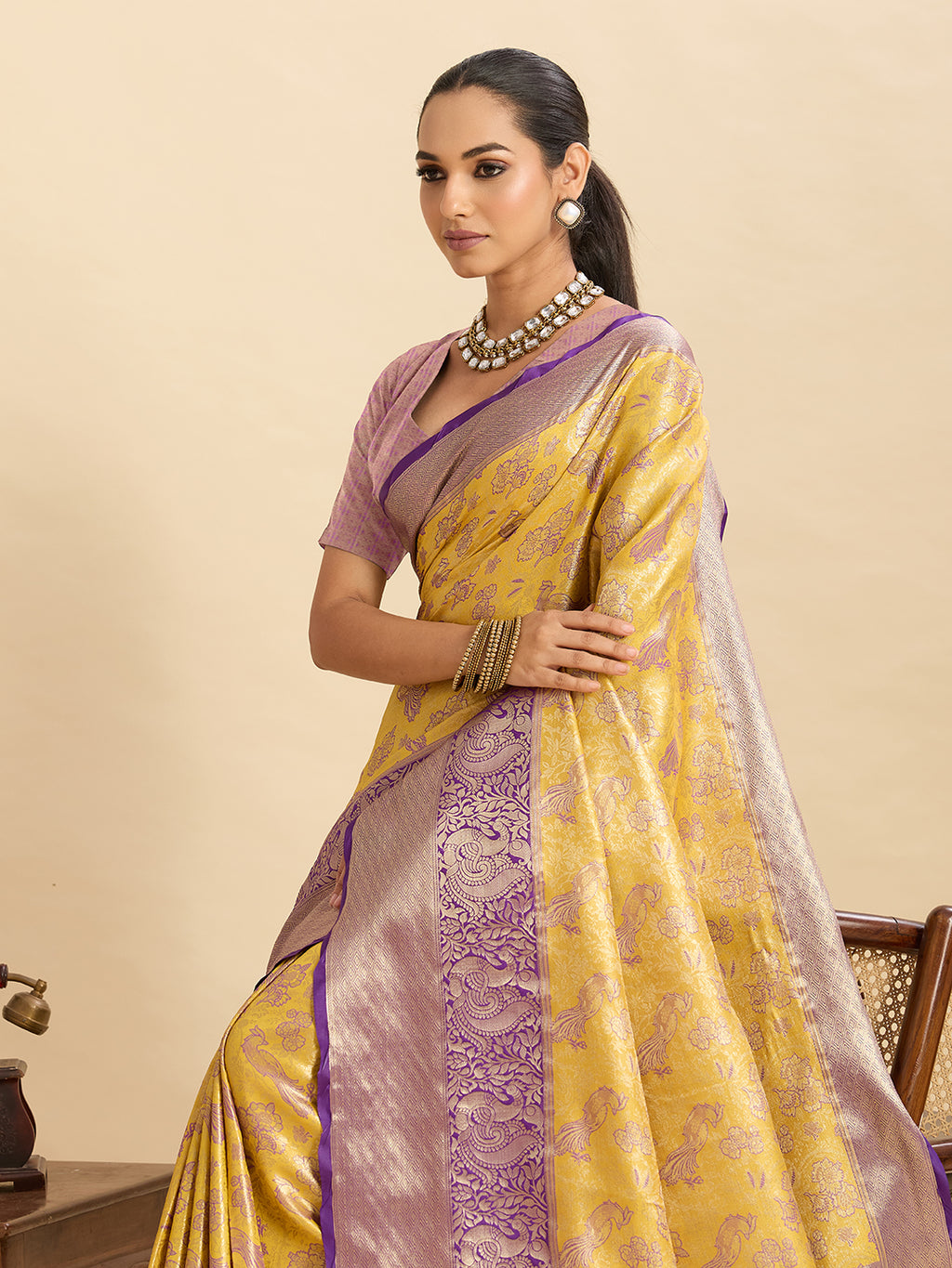 Yellow kanjivaram silk saree with zari weaving work and big border