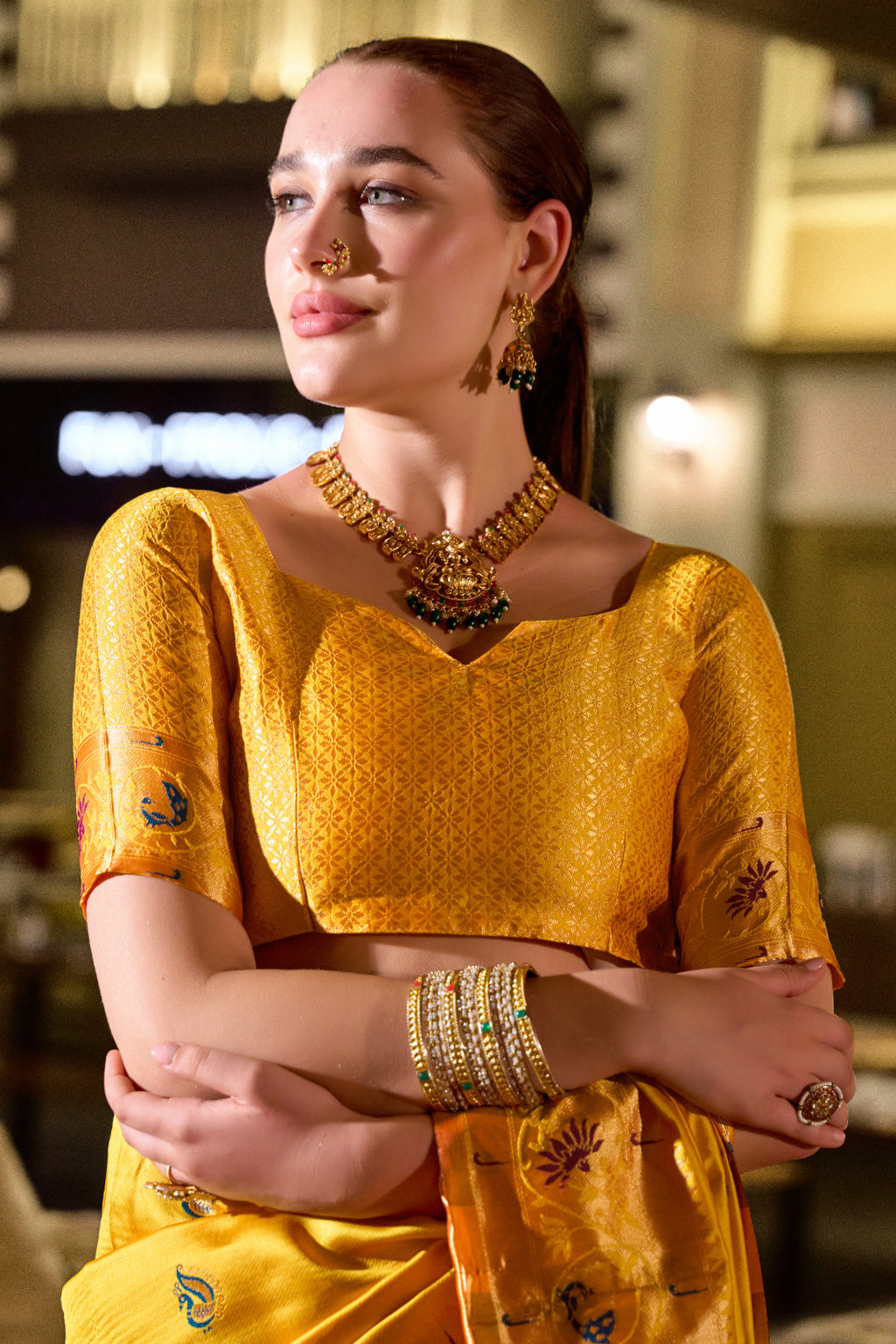 Traditional yellow paithani silk saree with zari weaving work