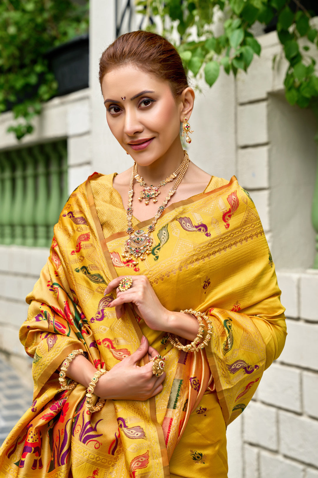 Traditional yellow paithani silk saree with zari weaving work