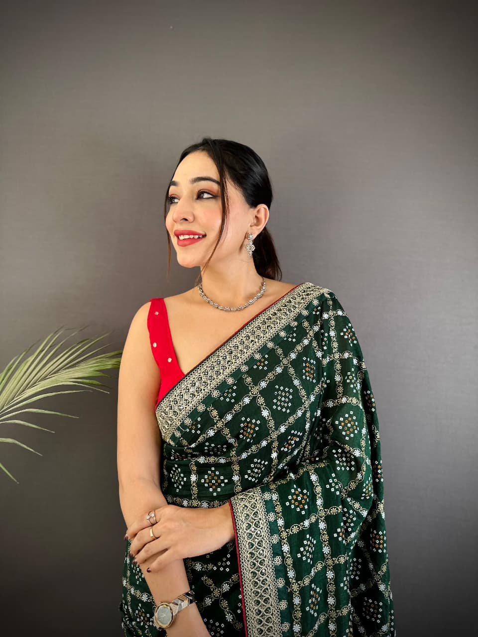 Dark green traditional blooming vichitra khadi bandhej silk saree with sequence work