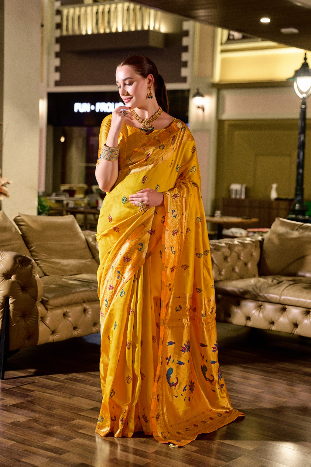 Traditional yellow paithani silk saree with zari weaving work
