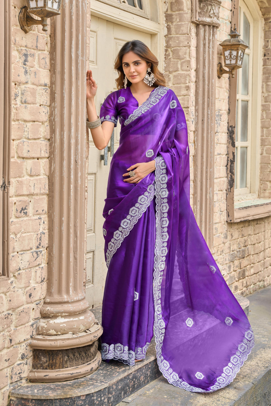 Purple fancy shimmer chiffon saree with embroidery work