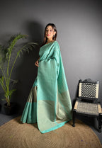 Sea green color banarasi silk saree with zari weaving work