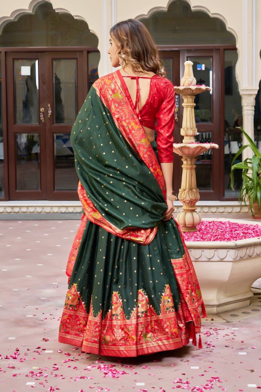 Green and red color dola silk lehenga with patola printed work