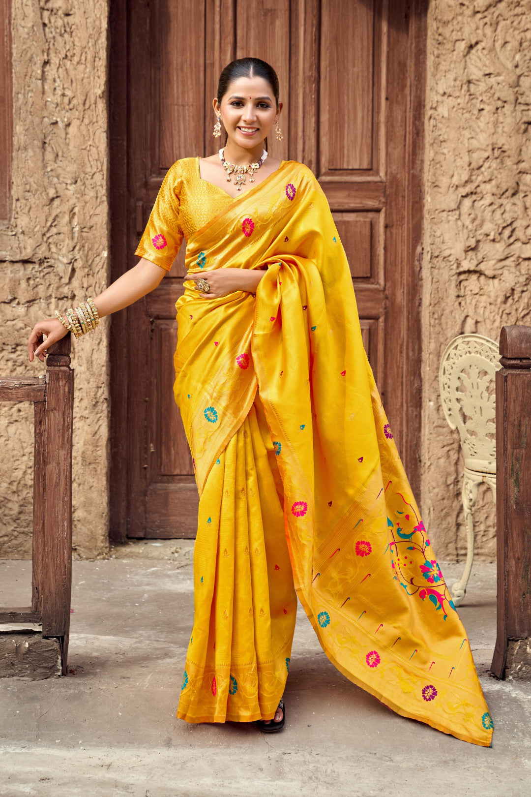 Traditional yellow paithani silk saree with zari weaving work