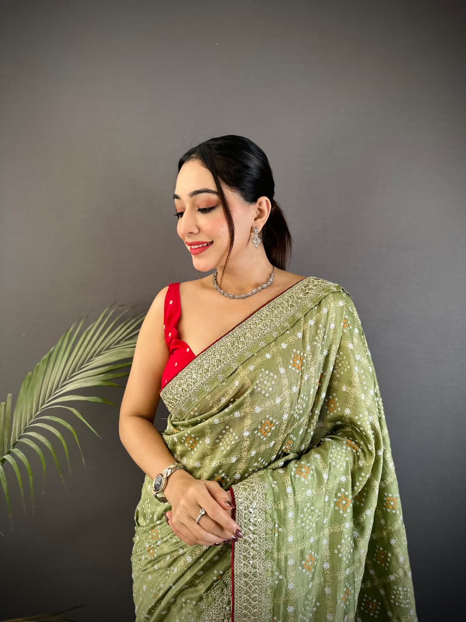 Parrot green traditional blooming vichitra khadi bandhej silk saree with sequence work